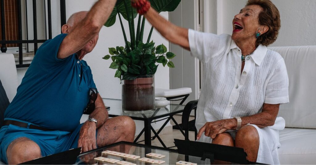 Memory Care: Beat Texas Heat with Indoor Activities 1 seniors playing in memory care